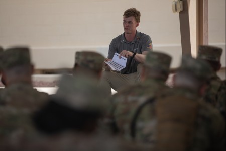U.S. Army Spc. Christian Sutton, assigned to Headquarters and Headquarters Battalion, 1st Armored Division, briefs Soldiers attending the Basic Leaders Course about bone marrow donations during the Operation Ring the Bell bone ...