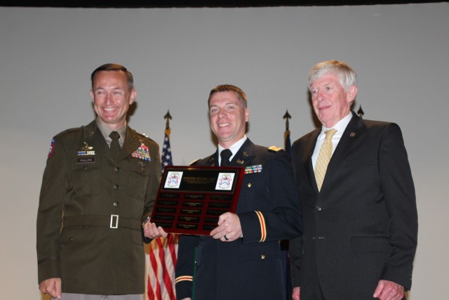 From left are commencement speaker Brig. Gen. David Phillips, the program executive officer for Aviation; distinguished honor graduate Maj. Jesse Hamilton; and Marvin Nickels, deputy director at the Command and General Staff School, Fort...