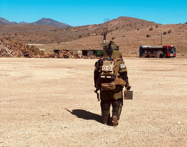 woman wears bomb suit