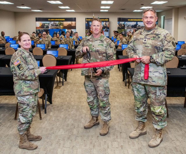 Colonel Jama VanHorne-Sealy, director of the Occupational Health Directorate, Col. Greg McLean, brigade commander of the 194th Armored Brigade, and Lt. Col. John Suprynowicz, battalion commander of the Soldier Recovery Unit, participate in a...