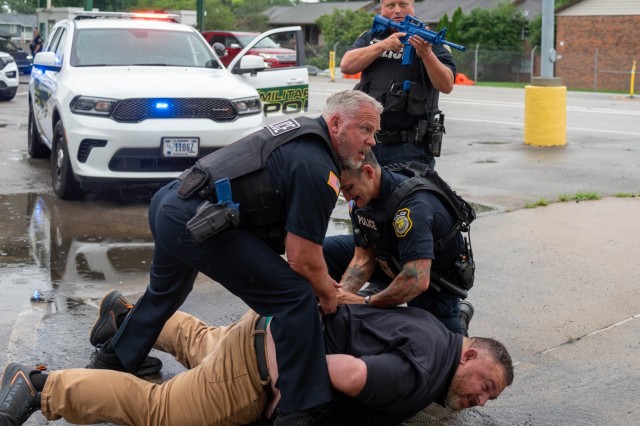 Redstone police respond to a simulated security event at Gate 10 on July 24.
