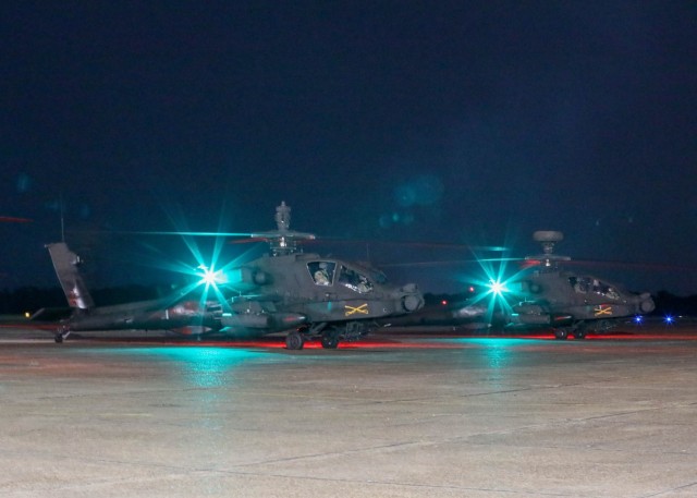 Soldiers from the 101st Airborne Division (Air Assault) take off into the night in AH-64 "Apache" helicopters during a large-scale, long-range Air Assault on Aug. 14, 2024, at Monroe Regional Airport, La. (U.S. Army photo by Spc. Brianna Badder)