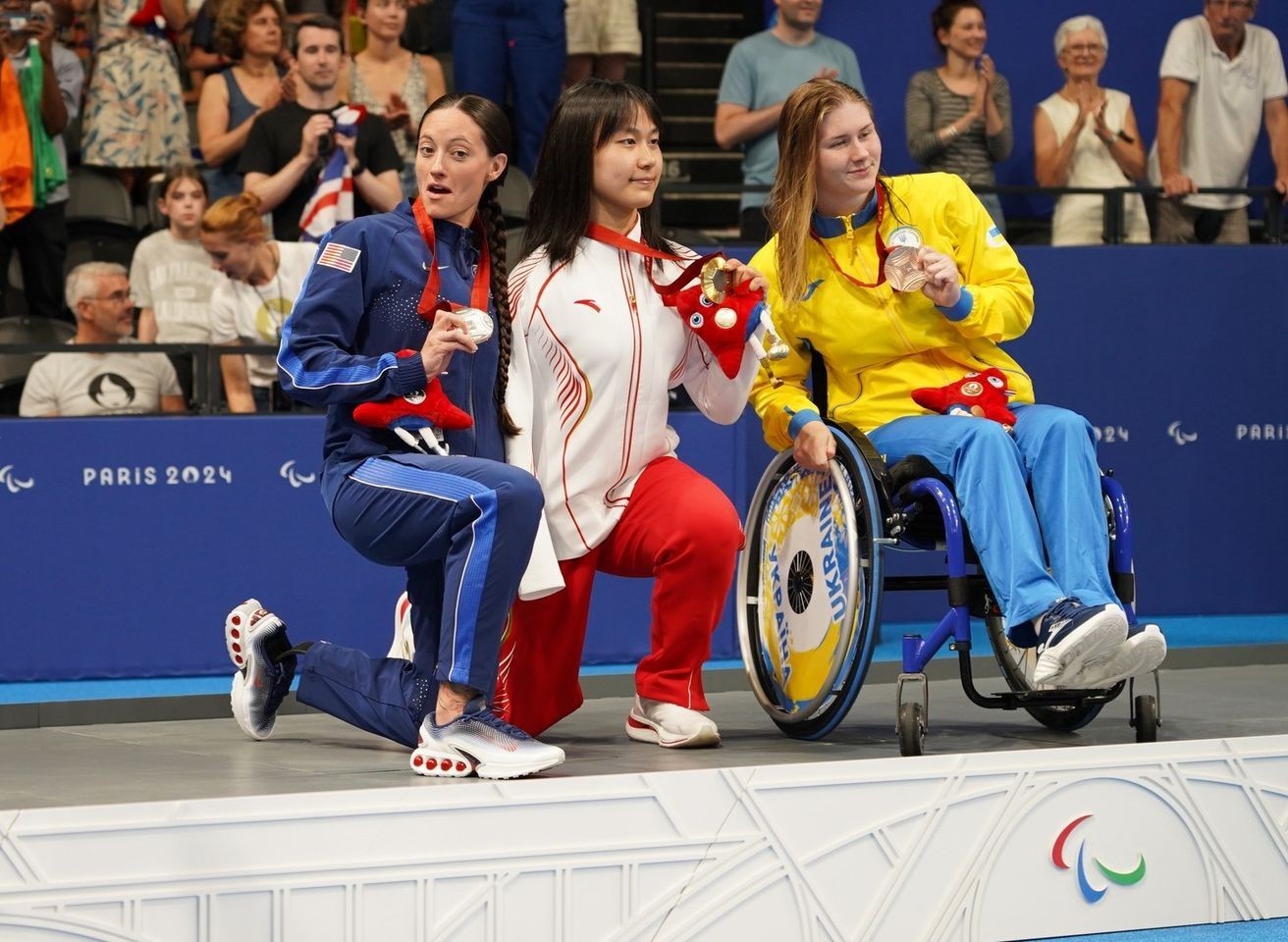 Sgt. 1st Class Elizabeth Marks, left, poses for a photo at the Paris 2024 Paralympic Summer Games. Marks earned Team USA their first medal of the games with a silver medal performance in the women&#39;s 50-meter freestyle S6. Marks earned her 6th...