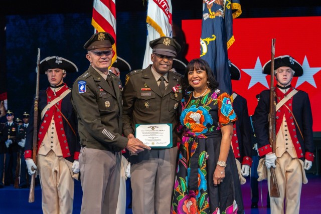 Lt. Gen. Kevin Vereen, center, and his wife, Monica are honored by Army Chief of Staff Gen. Randy A. George, left during Vereen&#39;s retirement ceremony at Joint Base Myer-Henderson Hall Aug. 28, 2024. 