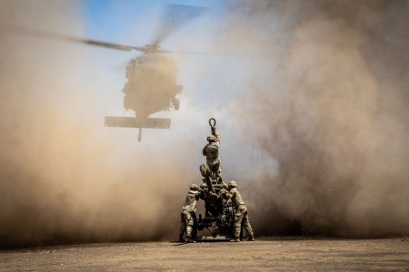 U.S. Army artillerymen with 3rd Battalion, 7th Field Artillery Regiment, 25th Division Artillery, 25th Infantry Division, prepare for the helicopter to sling load a M119 A3 105mm howitzer during Super Garuda Shield 2024 at Puslatpur 5, Indonesia...