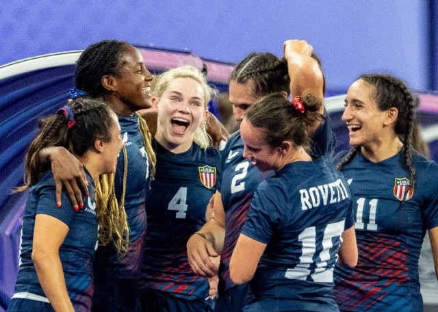 Capt. Samantha &#34;Sammy&#34; Sullivan, third from left, celebrates with her team during the U.S. quarterfinal victory over Great Britain. Sullivan scored on a late try to seal the 17-7 win. 