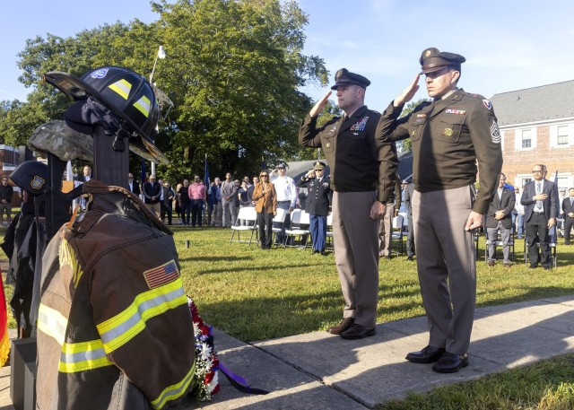 PICATINNY ARSENAL, N.J. - Maj. Gen. John T. Reim, Picatinny Arsenal’s Commanding General and Joint Program Executive Officer for Armaments and Ammunition (left), and Command Sgt. Maj. David M. Franks (right), render honors during a memorial...