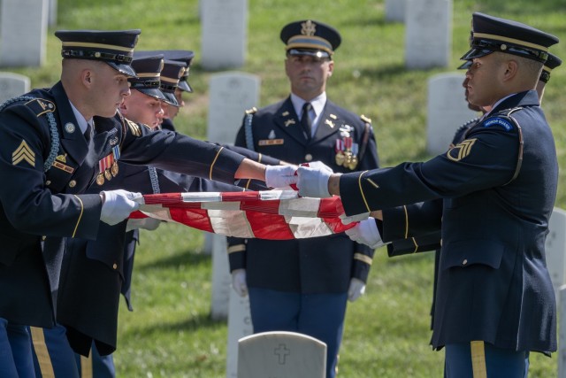 Soldiers from the 3d U.S. Infantry Regiment (The Old Guard) conduct military funeral honors for Chaplain (1st Lt.) George L. Fox in section 35 at Arlington National Cemetery, Sept. 4, 2024.