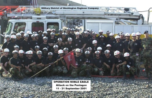 Retired Col. Aaron Barta, then a company commander with the Military District of Washington Engineer Company, second row standing, second from right, poses for a photo with his unit in September 2001.