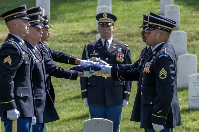 Soldiers from the 3d U.S. Infantry Regiment (The Old Guard) conduct military funeral honors for Chaplain (1st Lt.) George L. Fox in section 35 at Arlington National Cemetery, Sept. 4, 2024.