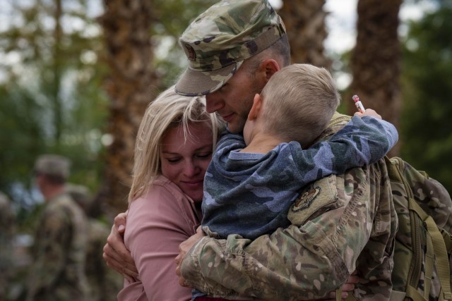 Capt. Jeremy Brenneman, a 99th Medical Group medic, is welcomed home from his deployment to Southwest Asia by his family at Nellis Air Force Base, Nevada, Oct. 18, 2021. The unit deployed in support of Operation Allies Refuge.