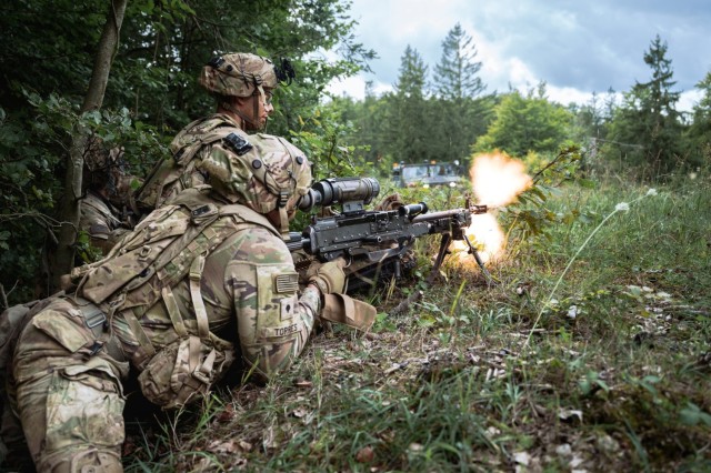 U.S. Army paratroopers assigned to the 173rd Airborne Brigade suppress enemy forces with a M240B machine gun during Saber Junction 24 at Hohenfels Training Area, Germany, Sept. 12, 2024.