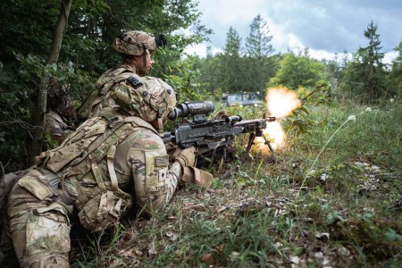 U.S. Army paratroopers assigned to the 173rd Airborne Brigade suppress enemy forces with a M240B machine gun during Saber Junction 24 at Hohenfels Training Area, Germany, Sept. 12, 2024.