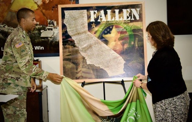 Gold Star Family Day: Fort Irwin welcomes regional Families for a day of remembrance 28 September, 2024. Col. Lane A. Bomar, the Fort Irwin Garrison Commander, unveils an illustration commemorating California&#39;s fallen natives.