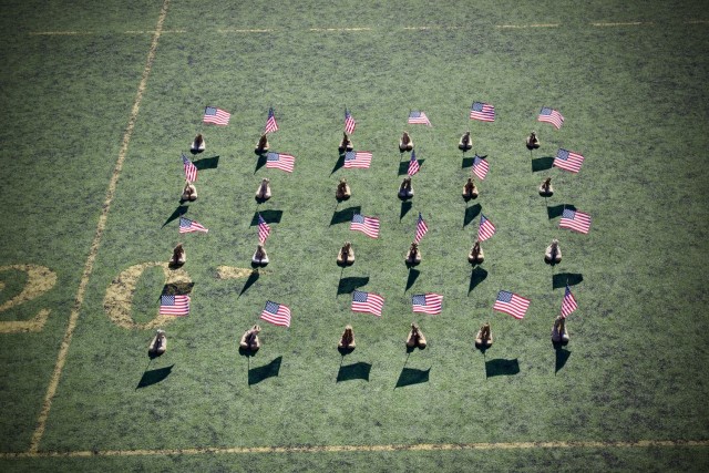 Gold Star Family Day: Fort Irwin welcomes regional Families for a day of remembrance 28 September, 2024.  A memorial of U.S. flags and empty combat boots was erected in commemoration of Family members killed in combat.