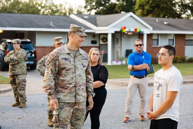 Spc. Edwin Melendez, Allen Heights resident and 906th Military Working Dog Detachment dog handler, speaks to Maj. Gen. Clair A. Gill, U.S. Army Aviation Center of Excellence and Fort Novosel commander, during a walking town hall Oct. 2.