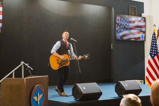 SSG (R) Keni Thomas, 3rd Ranger Battalion combat veteran, who fought in the Battle of Mogadishu, sings his song “Hold the Line” at the 31st anniversary of the Battle of Mogadishu inside the Army Aviation Museum Oct. 3, 2024.