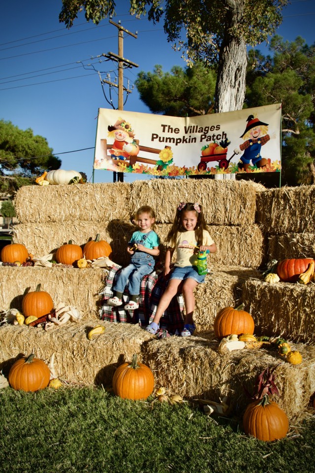 Fort Irwin Celebrates Oktoberfest 2024, A military Children pose for photos in the festival Pumpkin Patch 28 September.