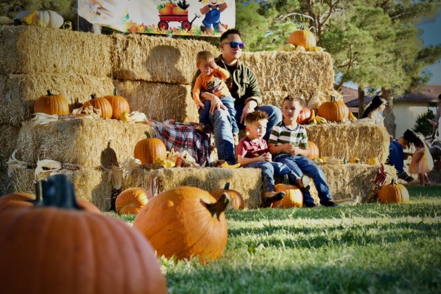 Fort Irwin Celebrates Oktoberfest 2024, A military Family poses for photos in the festival Pumpkin Patch 28 September.