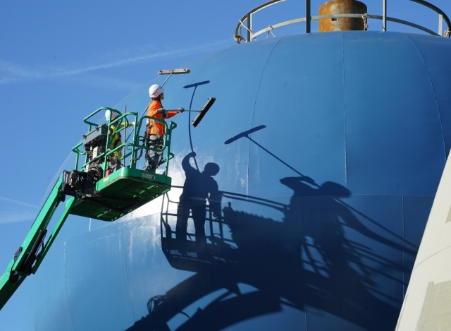Contractors prepare the surface of a water tower at the Louisville VA Medical Center for a second coat of paint Oct. 2, 2024.