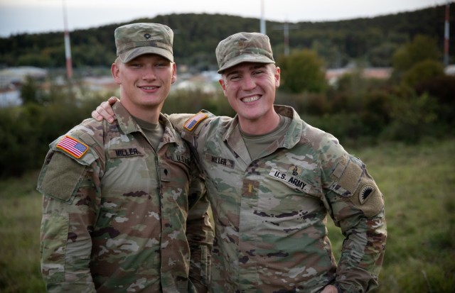 U.S. Army Spc. Markian Miller, left, and 2nd Lt. Lincoln Miller pose for a photo during Kosovo Force training at the Joint Multinational Readiness Center, Hohenfels, Germany, Sept. 29, 2024. Kosovo Force, also known as KFOR, includes 28 NATO allies and partner nations working together to provide safety and freedom of movement for the people of Kosovo.