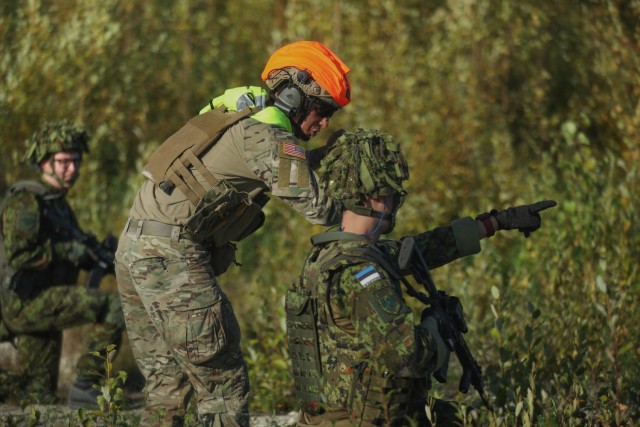 Maryland Army National Guard Sgt. Conner McClaskey, an infantryman with the 1-175th Infantry Regiment, speaks with a member of the Estonian Defense League during training exercise USSISONAD24 Sept. 8, 2024, at Sirgala live-fire range in Sirgala,...
