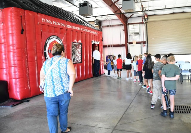 During this year’s Fire Prevention Week, the U.S. Army Yuma Proving Ground Fire Department (YPG FD) made sure the YPG community, regardless of age, learned about fire safety.  Here, YPG Fire Inspector Brad Henderson leads students through the...