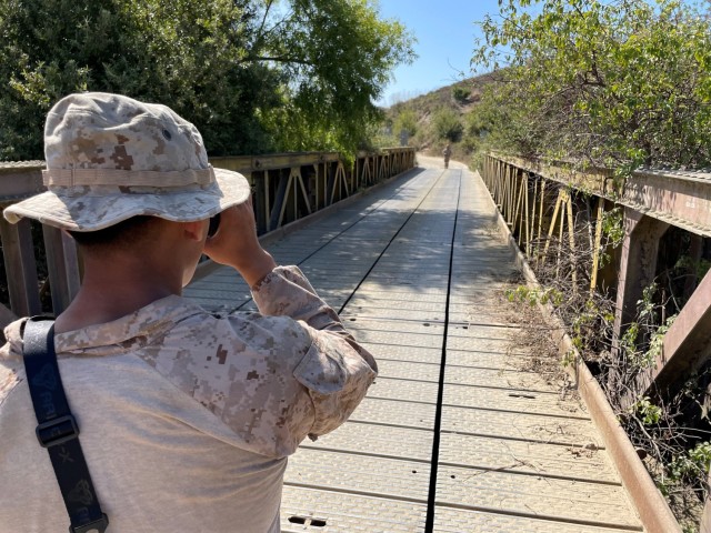 Marine with ENFIRE equipment for bridge reconnaissance.