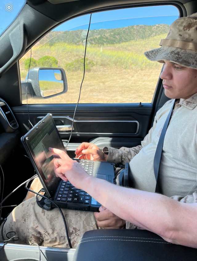 Marine using ENFIRE laptop.