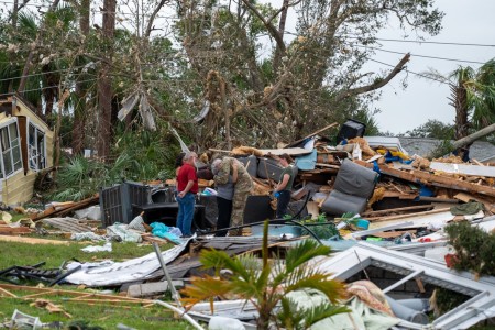 U.S. Soldiers assigned to Alpha Company, 1st Battalion, 124th Infantry Regiment, 53rd Infantry Brigade Combat Team, deliver water, meals and non-perishable goods to senior citizens in the Spanish Lake community in Port St. Lucie, Florida, Oct. 11,...