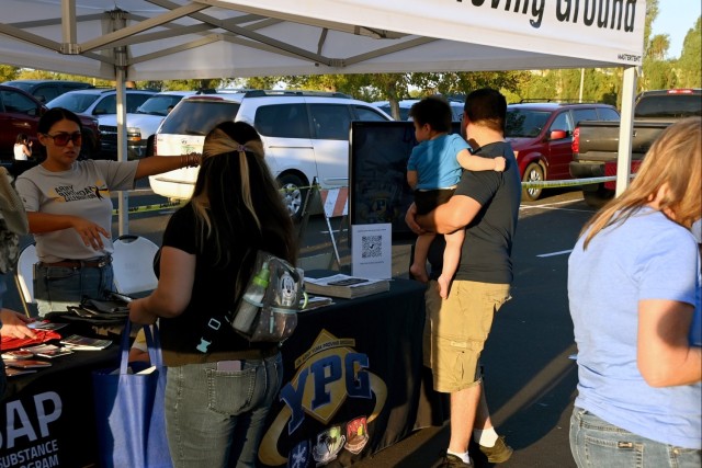 U.S. Army Yuma Proving Ground Public Affairs Specialist Ana Henderson (left) talks with eventgoers at the Yuma Police Department&#39;s annual Getting Arizona Involved in Neighborhoods (GAIN) at Yuma Palms Mall on October 12, 2024. The proving...