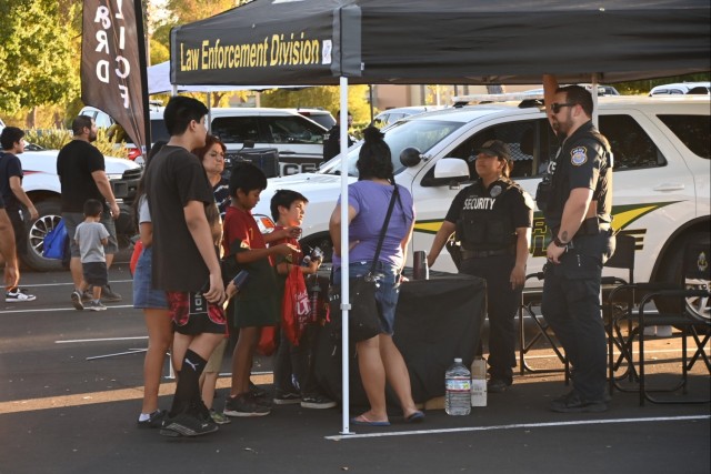 U.S. Army Yuma Proving Ground law enforcement and security personnel interact with eventgoers at the Yuma Police Department&#39;s annual Getting Arizona Involved in Neighborhoods (GAIN) at Yuma Palms Mall on October 12, 2024. The proving ground...