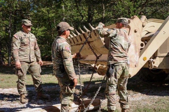 North Carolina National Guardsmen with the 113th Sustainment Brigade and the 30th Armored Brigade Combat Team conduct bridge-building operations in Nebo, N.C., Oct. 9, 2024, to connect roads for residents following Tropical Storm Helene. (U.S. Army National Guard photo by Staff Sgt. Hannah Tarkelly).