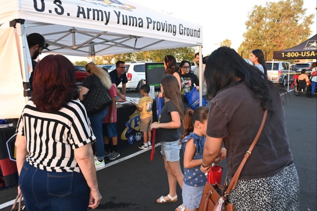 U.S. Army Yuma Proving Ground Public Affairs Officer Mark Schauer greets eventgoers at the Yuma Police Department&#39;s annual Getting Arizona Involved in Neighborhoods (GAIN) at Yuma Palms Mall on October 12, 2024. The proving ground has...