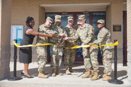 Fort Cavazos and the Fort Cavazos Food Program leadership cut the ribbon at the Headquarters Department of the Army Go for Green Action Station unveiling ceremony Oct. 9, 2024, at the Operation Iraqi Freedom Dining Facility at Fort Cavazos.