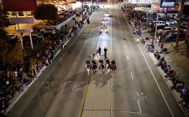 Soldiers from Fort Irwin & the U.S, Army National Training Center, led by the 11th Armored Cavalry Regimental Horse Detachment Color Guard, march down the center of Historic Route 66 during the 90th Mardi Gras Halloween Parade, October 19, 2024...