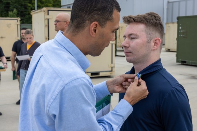 Col. Phillip P. Murrell (left) and Cpl. Jonathan L. Hoffman (right)
