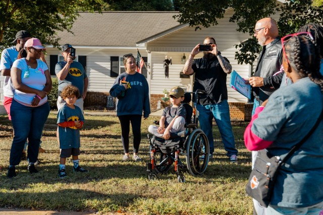 Sam Baker presents a certificate of bravery to Joseph Soroka during the 7th annual post-wide motorcycle ride for cancer on Fort Novosel Oct. 18.