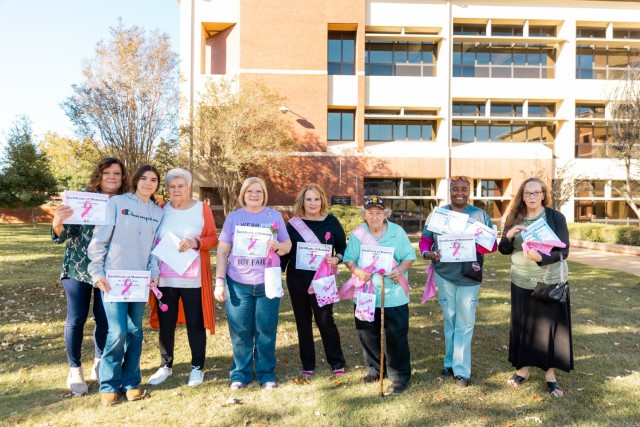 Fort Novosel community members receive survivor and memoriam certificates during the 7th annual post-wide motorcycle ride for cancer on Fort Novosel Oct. 18.