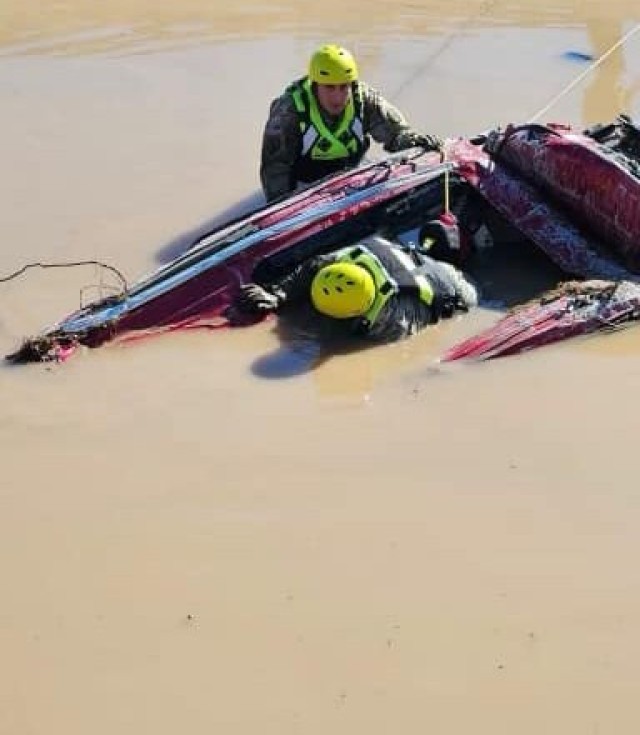 The New Mexico National Guard Community Emergency Response Team helps with flood recovery operations around Roswell Oct. 20, 2024, checking submerged vehicles for anyone who might need help. The Guard has helped rescue over 300 people from the extreme flooding.