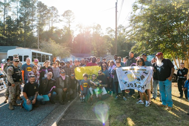 Participants of the 7th annual post-wide motorcycle ride for cancer present a certificate and flag to Joseph Soroka to culminate the ride on Fort Novosel Oct. 18.