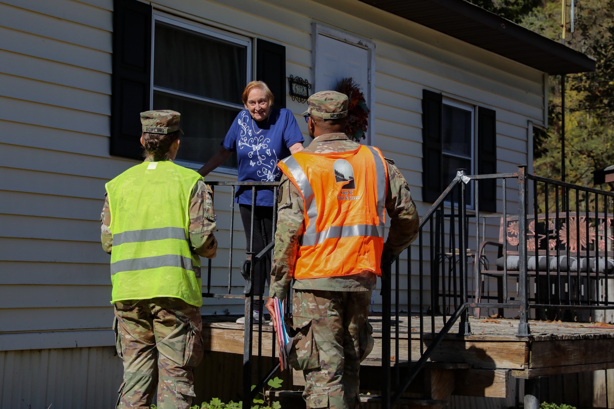 North Carolina National Guardsmen, assigned to the 113th Sustainment Brigade, knock on doors to assess community needs and provide resources in Waynesville, N.C., Oct. 14th, 2024. Joint Task Force-North Carolina deployed military capabilities in...