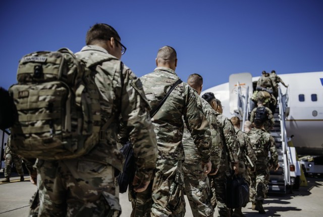 Citizen-Soldiers with 1st Battalion, 179 Infantry Regiment, Oklahoma Army National Guard prepare to board a charter flight in Oklahoma City, April 17, 2023. Soldiers on approved operational deployments will receive $240 per month under the recently approved operational deployment pay program.