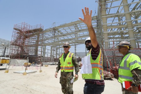 U.S. Army Col. Craig S. Baumgartner, U.S. Army Corps of Engineers Transatlantic Division deputy commander (left), and Col. Mahammad Z. Rahman, Transatlantic Expeditionary District commander (right), receive an update during a site visit of a Super...