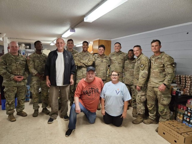 Spc. Randy Stuart (fifth from the right) and his unit, 1st Battalion, 502nd Infantry Regiment, 2nd Mobile Brigade Combat Team, 101st Airborne Division (Air Assault), helped deliver and distribute essential supplies to his hometown during hurricane relief efforts, Forest City, N.C. on Oct. 12, 2024.