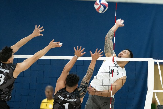 Army Sgt. Michael Tuimavave, a native of American Samoa, prepares to deliver a spike during the 2024 Armed Forces Volleyball tournament.  (DoD photo by EJ Hersom)