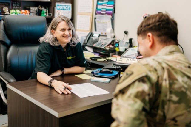 Army Emergency Relief provides support for Soldiers and their loved ones through the Family Advocacy Program. Jo Close, an AER officer at Fort Novosel, Alabama, speaks with a Soldier in her office.