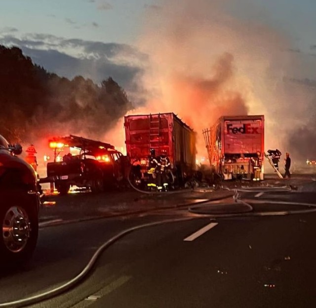 Firefighters fighting vehicle fire