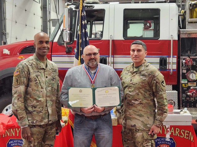 PICATINNY ARSENAL, N.J. - (from left) - Lt. Col. Craig A. Bonham II, Picatinny Arsenal Garrison Commander, Christopher Foster, former Director of the garrison’s Directorate of Emergency Services (DES), and former installation fire chief, and Command Sgt. Maj. David M. Franks.