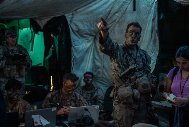 Col. James Stultz, commander of the 2nd Mobile Brigade Combat Team, briefs generals and the press about the capabilities of the 101st Airborne Division&#39;s command post during a training exercise at the Joint Regional Training Center on Fort Johnson, Louisiana, Aug. 22, 2024. This is the brigade’s first rotation at JRTC as a mobile brigade combat team.